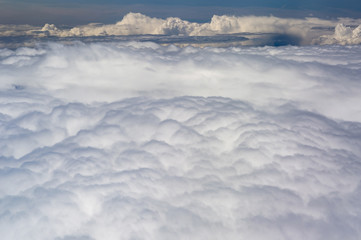 The top view on clouds from an airplane window