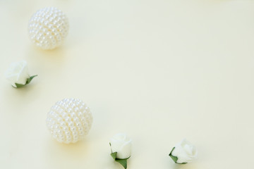 Styled stock photo. Feminine wedding desktop mockup. White roses and beads on delicate blue background. Copy space. Top view. Picture for blog.