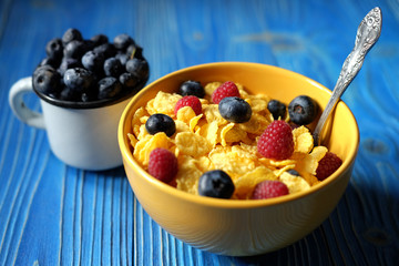 healthy eating and diet concept:  Corn flakes with raspberries a