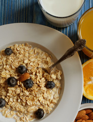 Healthy eating, food  and diet concept - tasty oatmeal with berr