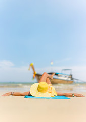 Fototapeta na wymiar Cute woman relaxing on the tropical beach. Vacation at Paradise. Ocean beach relax, travel to islands