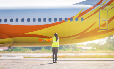 Airport marshalling signal from marshaller for aircraft controls. Ground Crew Signals Airport...