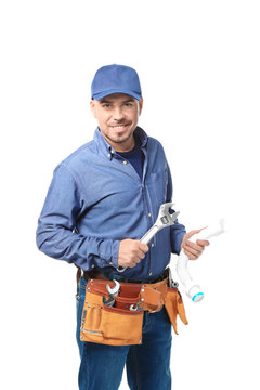 Plumber with tools and plastic pipe on white background