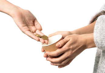 Woman putting coins into cup in hands of female beggar, isolated on white