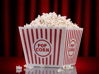 popcorn box on red curtain background