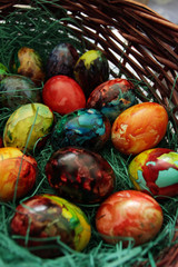 Easter eggs. Handmade painted eggs in basket for Easter celebration with art light. Easter. Colored Easter eggs. Colorful egg. Copy space. Text space. Unique handmade painted eggs