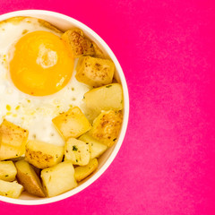 Fried Egg With Fried Potatoes In A Bowl