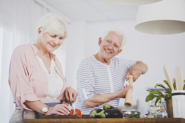 Senior couple preparing healthy meal