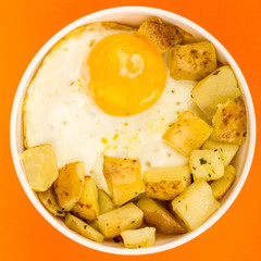Fried Egg With Fried Potatoes In A Bowl