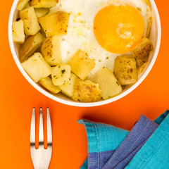 Fried Egg With Fried Potatoes In A Bowl