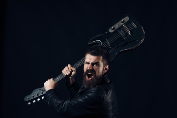 Bearded man with beard with electric guitar