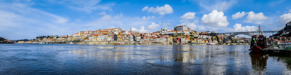 Fototapeta na wymiar Panoramic view of downtown of Porto, Portugal with Dom Luis I Bridge over Douro River.