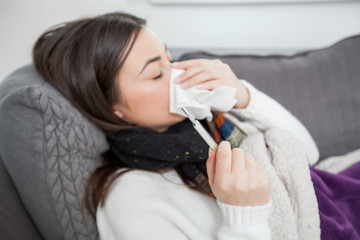 Young ill woman at home