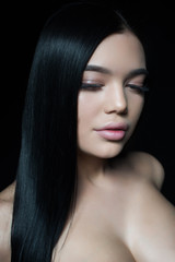 Obraz premium Portrait of a young girl with lush lips and long eyelashes. Perfect fresh young skin.