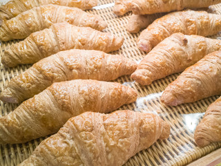 The fresh croissants in bakery display image for background.