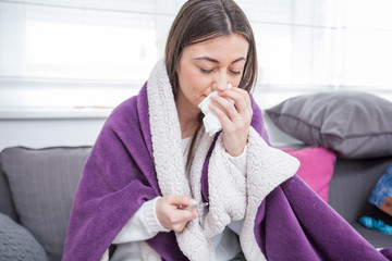 Young ill woman at home