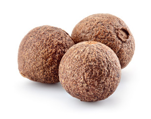 Allspice pepper isolated on white. Three peppercorns. Macro. Full depth of field.