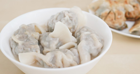 Eating chinese soup meat dumpling