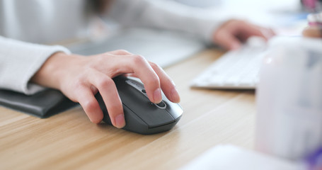 Working on drawing pad and computer at home © leungchopan