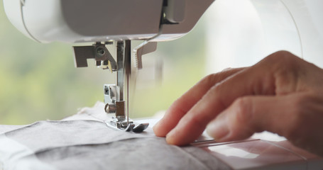 Sewing machine stitching on fabric
