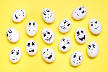 Eggs with drawn cartoon faces with various emotions