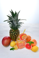 Ice refreshing summer drink with lots of different fruits. Space for text or design.