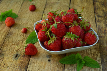 Organic fresh strawberry from garden. Preparation for making berry compote or jam. Homemade conservation for the winter. Raw food. Copy space.