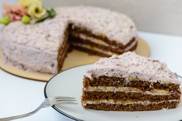 homemade cake with cream and fresh flowers