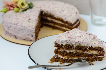 homemade cake with cream and fresh flowers