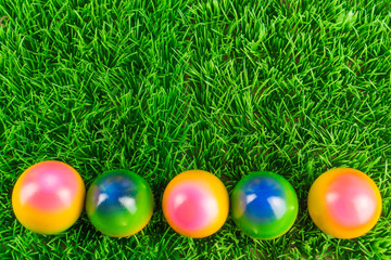 Fototapeta na wymiar Colorful Easter eggs in the meadow