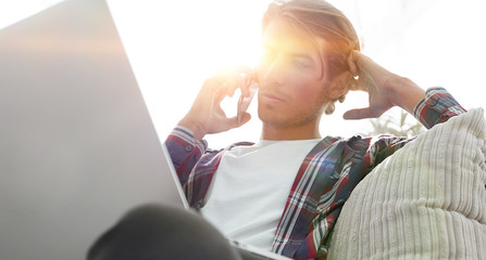 close-up of a successful guy talking to a smartphone