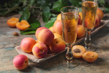 Juicy apricots  and glass of sweet wine .