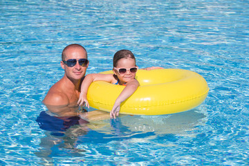 Family In Swimming Pool