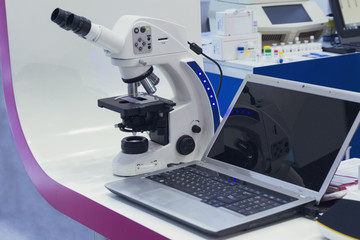 Microscope and a laptop in a medical laboratory. Medicine