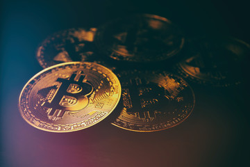 Golden Bitcoin over black background. Business concept.