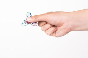 Hand holding fidget spinners