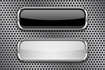 Black and white glass buttons with metal frame, on perforated background