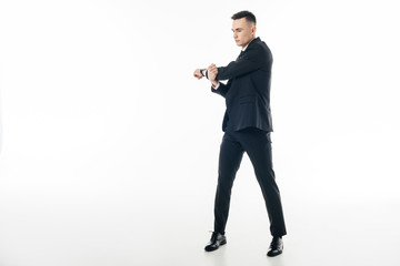 Fototapeta premium businessman in suit stretching hands isolated on white