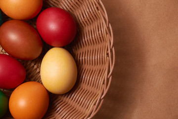 Colorful Easter eggs on brown background Close-up