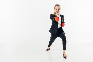 businesswoman screaming in suit and red gloves isolated on white