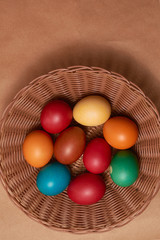 Colorful Easter eggs on brown background Close-up