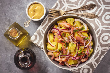 Potato salad with bacon, red onion and mustard sauce.