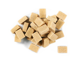 pile brown cane sugar cubes isolated on white background, top view