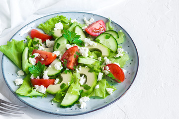Avocado, feta and vegetables salad