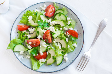 Avocado, feta and vegetables salad