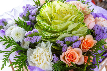 Bright buketny composition from fresh flowers, the white isolated background