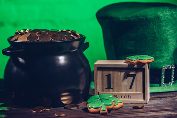 calendar, cookies in shape of shamrock, green irish hat and pot with golden coins, st patricks day...