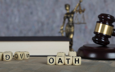 Word OATH composed of wooden letters.