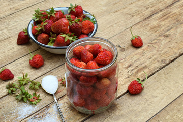Organic fresh strawberry from garden. Preparation for making berry compote or jam. Homemade conservation for the winter. Raw food. Copy space.