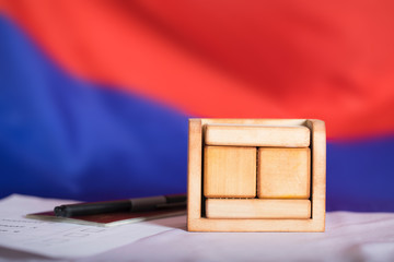 Wooden calendar with free text in front of Russian flag.